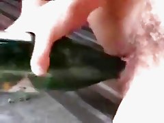 Crazy milf drinks champagne and nails herself