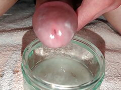 Edging lubed up cock leaking s, then releasing big mighty huge load in glass bowl, super extreme close-up cumshot, sperm