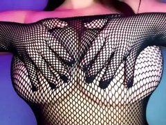 Voluptuous milf in fishnets exposes her massive natural tits