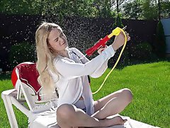 Addictive young blonde rubs her pussy wet in backyard solo fantasy